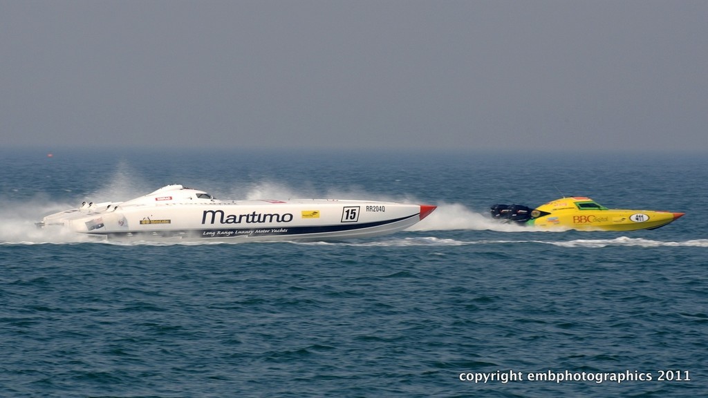 Class 1 entry ’Maritimo’ moves up to pass Supercat Outboard boat ’B.B.C. Digital’ during the Redcliffe GP. - Redcliffe Offshore Race © Reg Blunt http://www.embphotographics.com.au